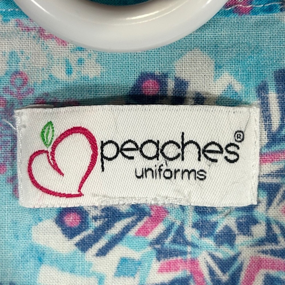 Peaches Uniforms Women's Size XL Scrub Top Blue Pink Snowflake Glitter V-Neck - Picture 3 of 8